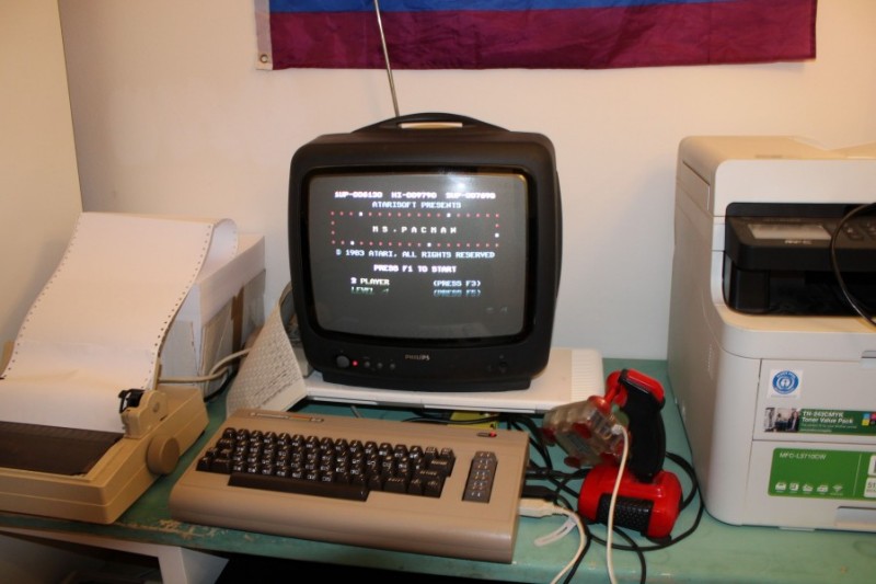 Picture of an old CRT TV with the title screen of Miss Pacman